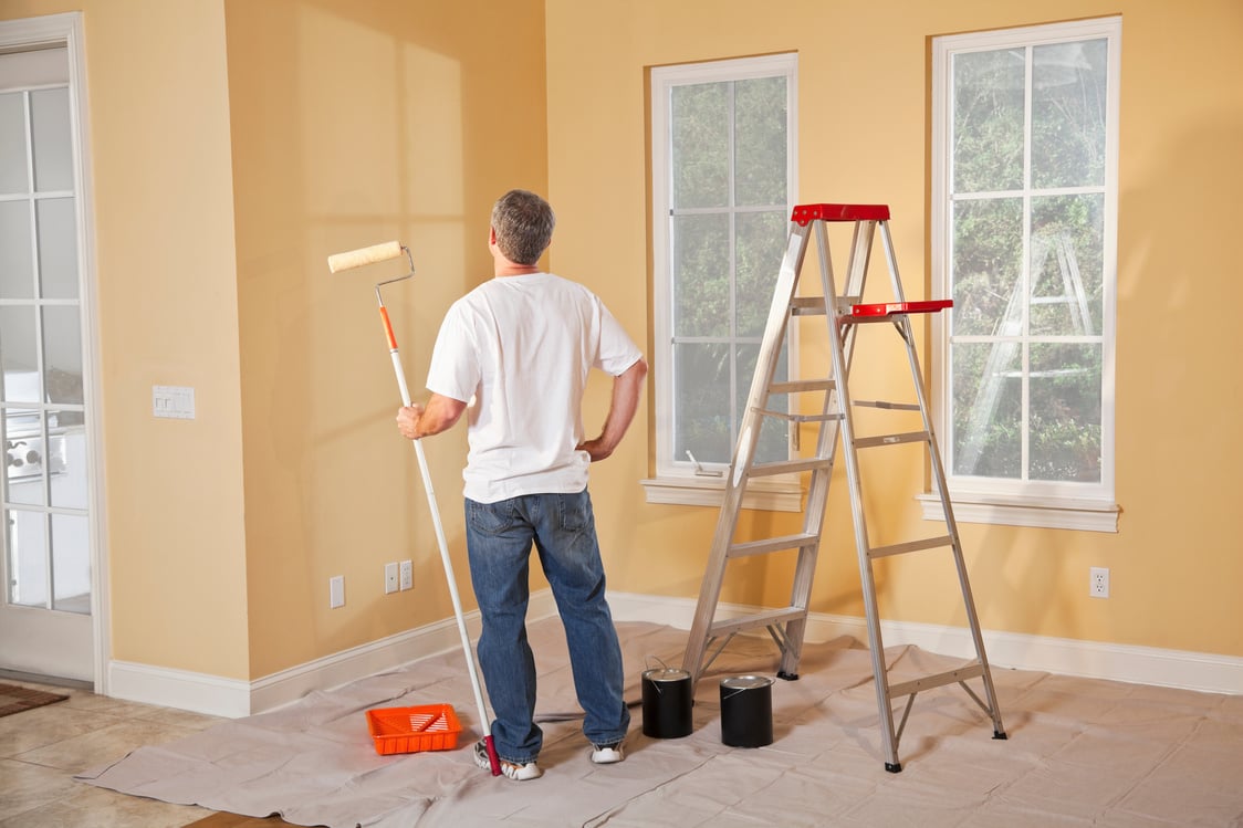 Man painting home interior